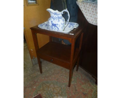 A 19th c. Mahogany campaign Washstand, the legs united by a lower shelf with a frieze drawer, 22 3/4'' x 15 1/4''" x 32 1/4''