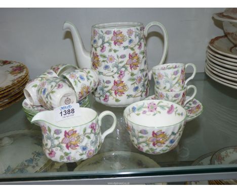 A Minton 'Haddon Hall' part coffee set to include; 6 cups & saucers, sugar bowl, creamer and a teapot (no lid).