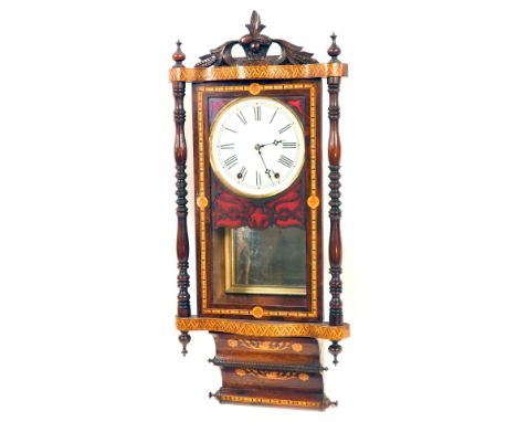 A late 19thC American rosewood and marquetry inlaid wall clock, with a shaped wheatsheaf cornice and crosshatched and bowed s