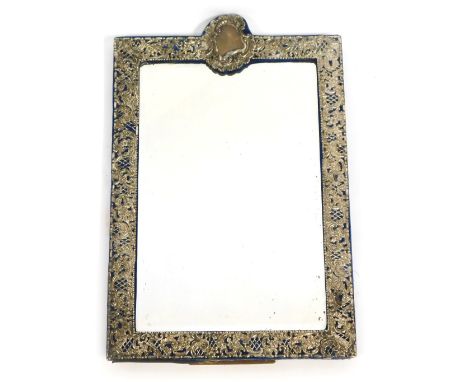 An Edward VII silver mounted strut mirror, of rectangular form, embossed and pierced with rococo scrolls, flowers and a shiel