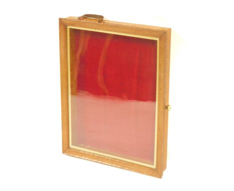 A light wood table top display cabinet, with a red lined interior, 37cm x 47cm, 7cm high.