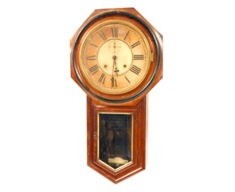A late 19thC Ansonia Clock Company mahogany drop dial wall clock, the hexagonal outer casing on a white painted Roman numeric