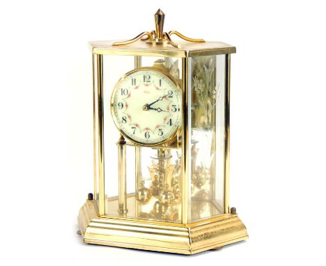 A Kundo brass cased hexagonal anniversary clock, with a cream numeric dial, 22cm high, 16cm wide.