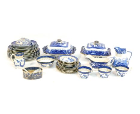 A group of blue and white pottery, comprising three tureens one cover, various graduated dinner plates, a Copeland Spode milk