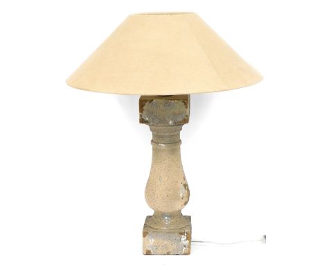 A rustic painted pine table lamp, on a stepped foot, with cream shade, the base 73cm high.