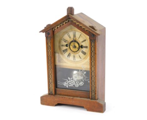 A late 19thC German mantel clock, the arched top with parquetry inlaid borders, with a raised open movement, on a cream Roman