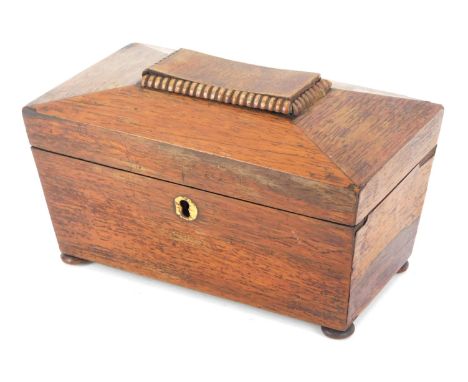 A Regency rosewood tea caddy, of sarcophagus form, twin canisters, on bun feet, 11cm high, 22cm wide, 12cm deep. (AF)