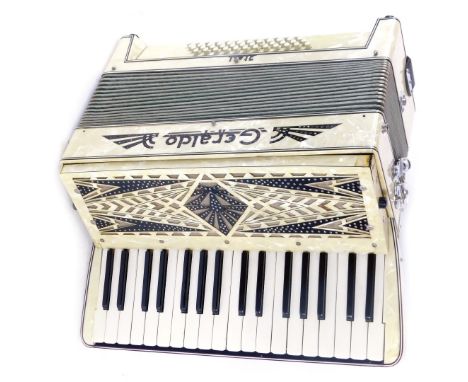 A Geraldo Itali accordion, forty eight button, with mother of pearl and diamante detail, in a fitted carry case, 28cm high, 4