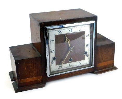 A 1950's Art Deco Revival oak cased mantel clock, 21cm high.