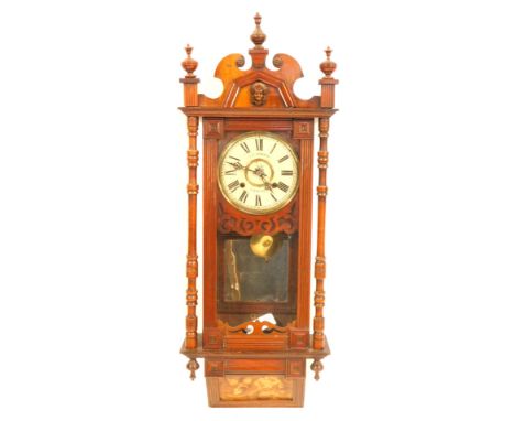 A late 19thC J G Graves of Sheffield inlaid mahogany wall clock, with a moulded cornice bearing Medusa's head, on a cream pai