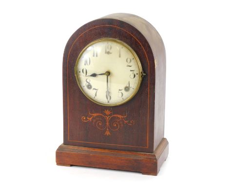 An early 20thC American Wm L Gilbert Clock Co dome top mantel clock, in a mahogany case with a numeric ceramic dial, with thi