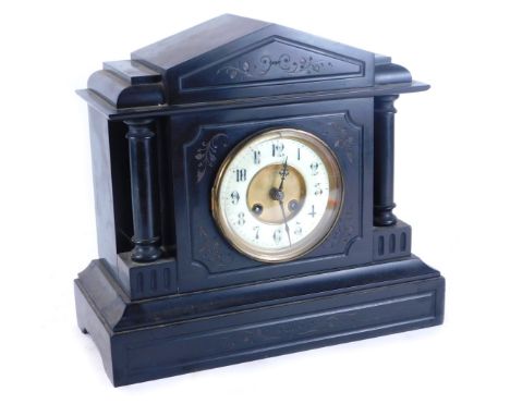 A 19thC black slate mantel clock, cream enamel numeric dial and brass chapter ring,  eight day movement with coil strike, the