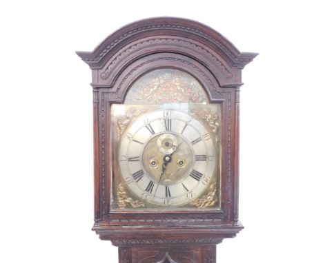 E Hariman of Workington. A Georgian oak longcase clock, silvered break arch dial with pierced decoration of Putti and foliate