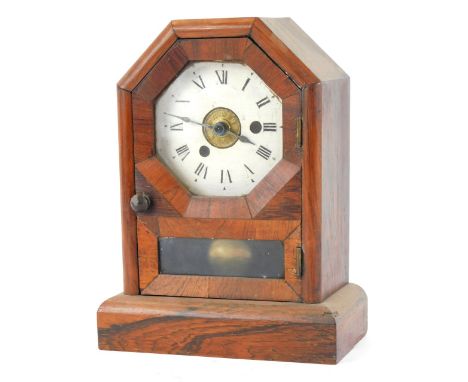 A late 19thC American rosewood cased mantel clock, with an octagonal dial, white painted Roman ceramic surround, with glazed 