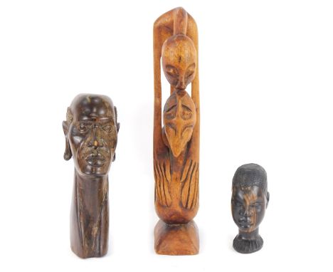 Tribal Art. Three carved wooden figures, comprising a bald headed gentleman, 28cm high, child, 14cm high, and a figure arched