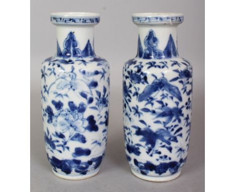 A SMALL PAIR OF 19TH CENTURY CHINESE BLUE & WHITE PORCELAIN ROULEAU VASES, each painted with butterflies, birds and floral sp