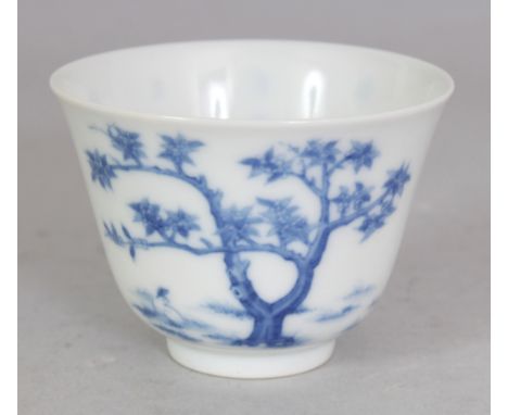 A GOOD QUALITY CHINESE BLUE & WHITE PORCELAIN WINE CUP, decorated with a rabbit beneath a tree and also with calligraphy and 