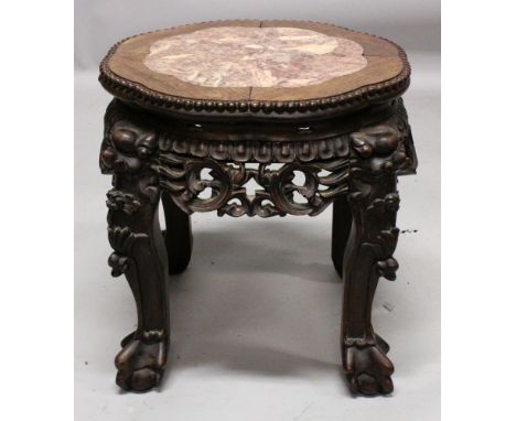 ANOTHER 19TH CENTURY CHINESE MARBLE-TOP HARDWOOD STAND, of octofoil section, the frieze carved and pierced with scroll work, 