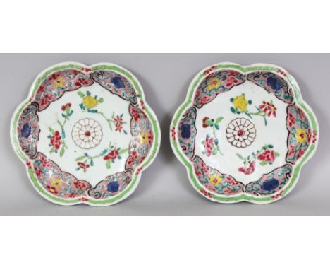 A GOOD PAIR OF MID-18TH CENTURY CHINESE FAMILLE ROSE PORCELAIN DISHES, of teapot stand form, each unusually moulded to its ce