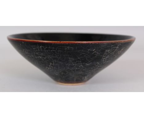 A CHINESE SONG STYLE JIZHOU CERAMIC LEAF BOWL, the base unglazed, 5.9in diameter & 2.1in high.