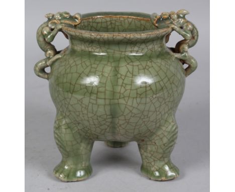 A CHINESE CELADON GLAZED CRACKLEGLAZE PORCELAIN TRIPOD CENSER, the shoulders and neck moulded with double chilong handles, 5.