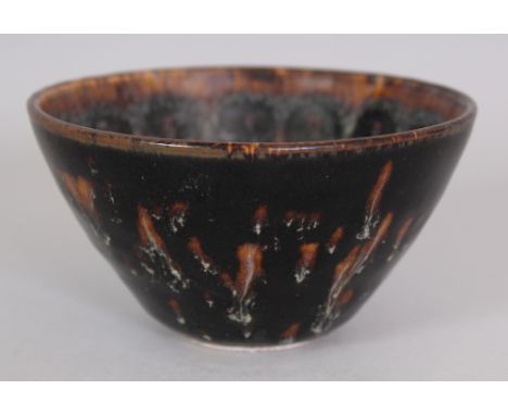A CHINESE JIZHOU TORTOISESHELL CERAMIC BOWL, the interior with a pattern of repeated circular spots, the base unglazed, 4.4in