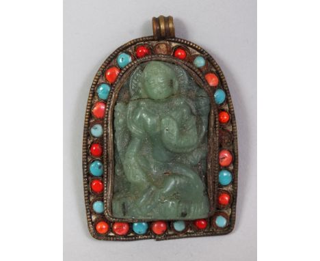 A TIBETAN STONE ONLAID BRONZE ALLOY PENDANT, inset to its centre with a green jade-like plaque of a deity, 2.5in high.