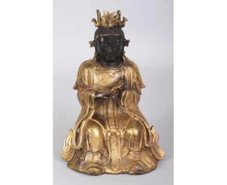 A 19TH/20TH CENTURY CHINESE MING STYLE GILT BRONZE FIGURE OF A SEATED BODHISATTVA, seated on a double lotus plinth and bearin