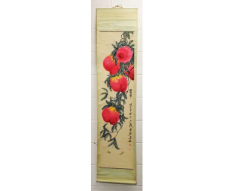 A CHINESE HANGING SCROLL PICTURE ON PAPER, depicting hanging peach, the picture itself 52.75in x 13.25in.