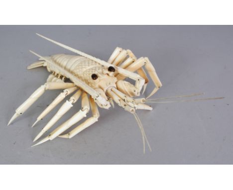 AN EARLY 20TH CENTURY JAPANESE ARTICULATED IVORY MODEL OF A CRAYFISH, with moveable body, scales, legs and antennae, 9.75in l