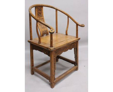 A FINE QUALITY 18TH/19TH CENTURY CHINESE HORSESHOE BACK SOFTWOOD ARMCHAIR, its back piece finely carved with a scholar restin