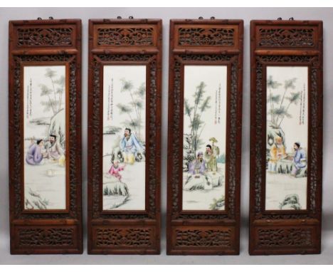 A SET OF FOUR LARGE CHINESE WOOD FRAMED FAMILLE ROSE PORCELAIN PANELS, decorated with scenes of sages and calligraphy, each w