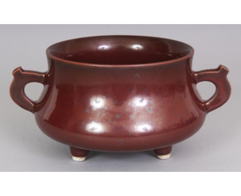 A CHINESE IRON RUST GLAZED PORCELAIN TRIPOD CENSER, 7in wide at widest point including handles & 3.4in high.