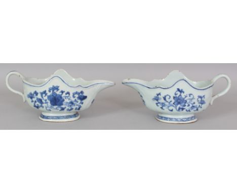 A PAIR OF 18TH CENTURY CHINESE QIANLONG PERIOD PORCELAIN SAUCEBOATS, of European silver form, each painted with scroll-stemme