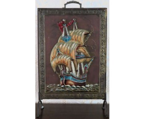 Early 20th century brass firescreen with relief decorated galleon. Approx. 62cm H

Reasonable used condition 