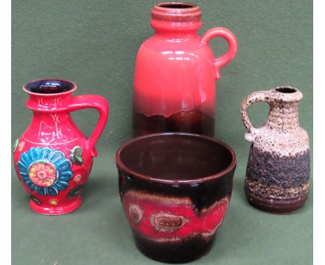 Three vintage West German glazed pottery jugs, plus small planter. Largest Approx. 27cms H

floral jug chipped to rim. rest r