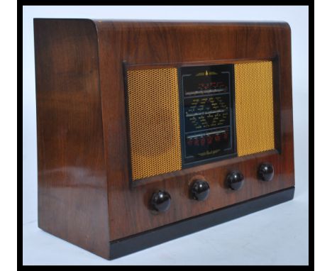 A vintage 20th Century wooden cased Bush Type DAC 11 valve radio.