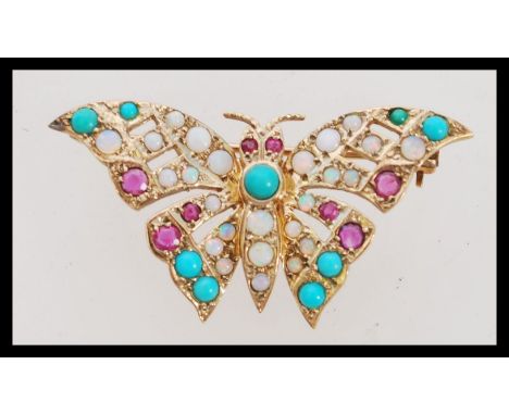 A vintage hallmarked 9ct gold opal, ruby and turquoise brooch in the form of a butterfly. Makers HBJ weighs 5.2 grams.