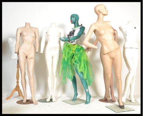 A collection of six full body vintage shop display mannequins including attached garments (please see photographs) and manneq