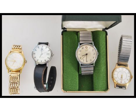 A group of three vintage watches to include a Tissot 9ct gold metal core, Ingersoll Shockproof and a boxed Timex.