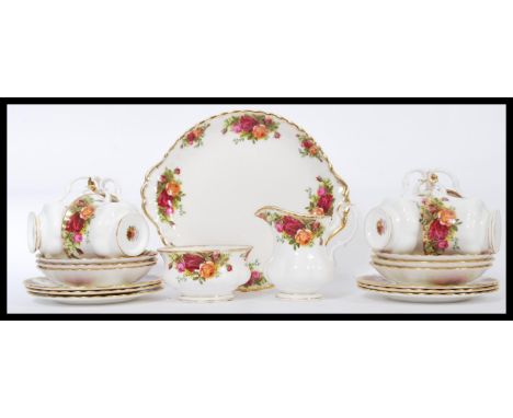 A Royal Albert six person Old Country Roses tea set, consisting of six cups, saucers and side plate trios, milk jug, sugar bo