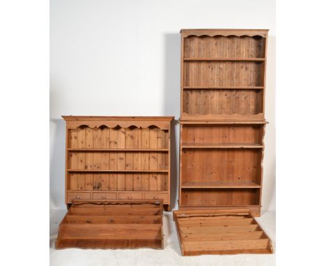 A country pine bookcase together with a hanging pine shelf with spice drawers, a hanging pine bookcase and another rack