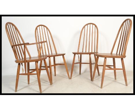 A set of four vintage 20th century Priory Ercol style Windsor chairs having spindle back rests. Consisting of three chairs an