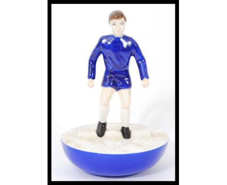 A Royal Doulton Subbuteo ceramic football figurine MCL 12 featuring a player in blue kit on blue and white base. Limited edit