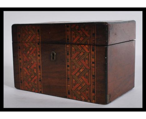 A 19th century Victorian&nbsp;small Tunbridge ware tea caddy having brass lock and key escutcheon. The hinged lid opening to 