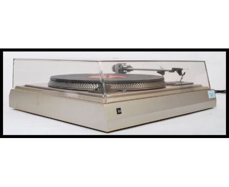 A Dual CS 505 - 1 belt drive record player, clear perspex lid to top, chrome affect housing.