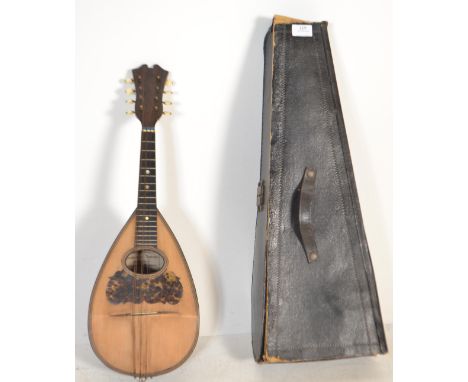 Musical Instruments. A vintage cased Italian mandolin bearing label for Domenico Banoni, instrument maker of Napoli. Bowl bac