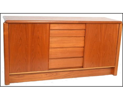 Skovby - A retro vintage Danish teak wood sideboard having an arrangement of drawers and shelved storage cupboards raised on 