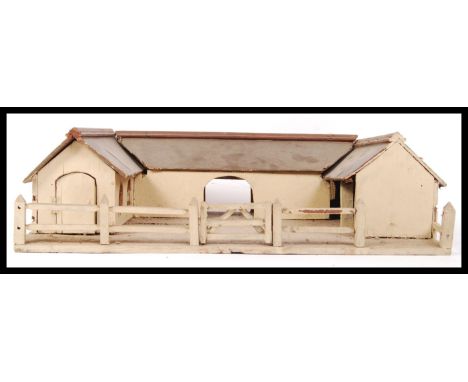 An original vintage pre WWII second world war Britains style wooden toy farm, the building in a horseshoe shape with wooden f