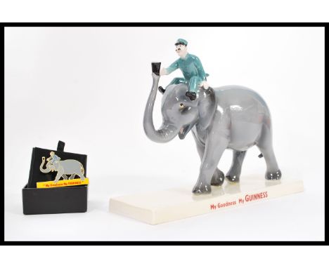 A Coalport ceramic Guinness advertising figurine Elephant and Keeper. Limited Edition 333/800. Complete in original box with 